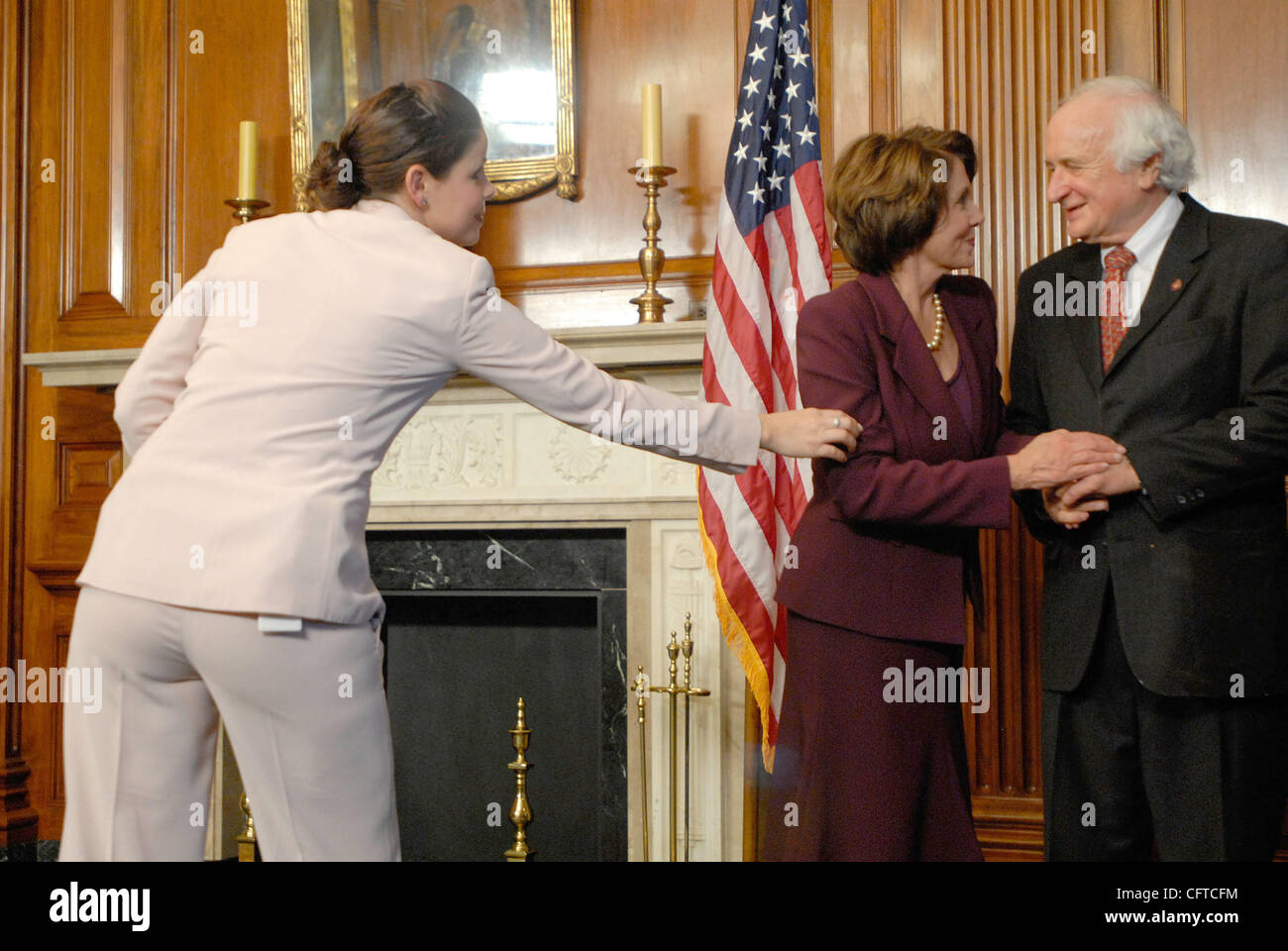 Jan 04, 2007 - Washington, DC, USA - Speaker of the House NANCY PELOSI swears in Rep. SANDERS LEVIN (D-MI) for the 110th Congress. Sanders was joined by his brother Carl, who serves as a Senator from Michigan. Stock Photo
