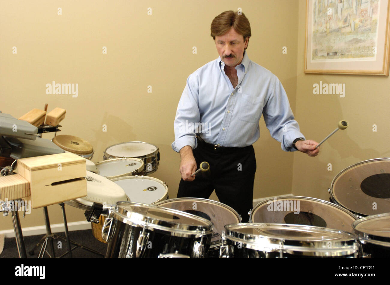 California Symphony conductor Barry Jekowsky plays drums at his home in Tiburon, Calif., on Monday, January 8, 2007.  Jekowsky will play percussion for the first time since 1995 during the symphony's performance of Michael Torke's 'Rapture:  Drums and Woods'.    (Nader Khouri/Contra Costa Times) Stock Photo