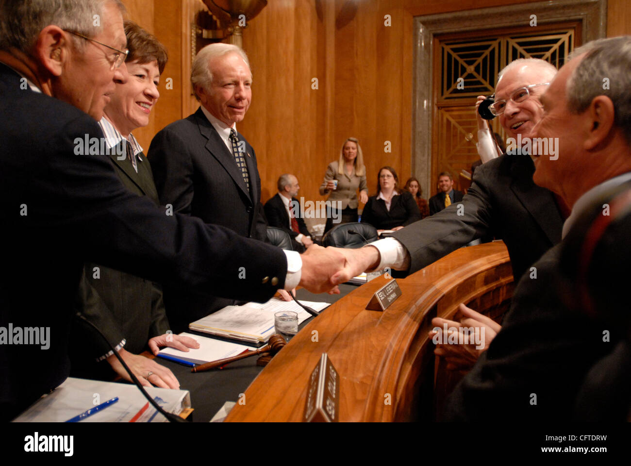 Jan 09, 2007 - Washington, DC, USA - (L-R) Senators GEORGE VOINOVICH (R-OH) SUSAN COLLINS (R-ME) and JOSEPH LIEBERMAN (I-CT) meet with 9/11 Commission co-chair Lee Hamilton and New York City Mayor Michael Bloomberg before the Senate Committee on Homeland Security and Government Affairs hearing on im Stock Photo