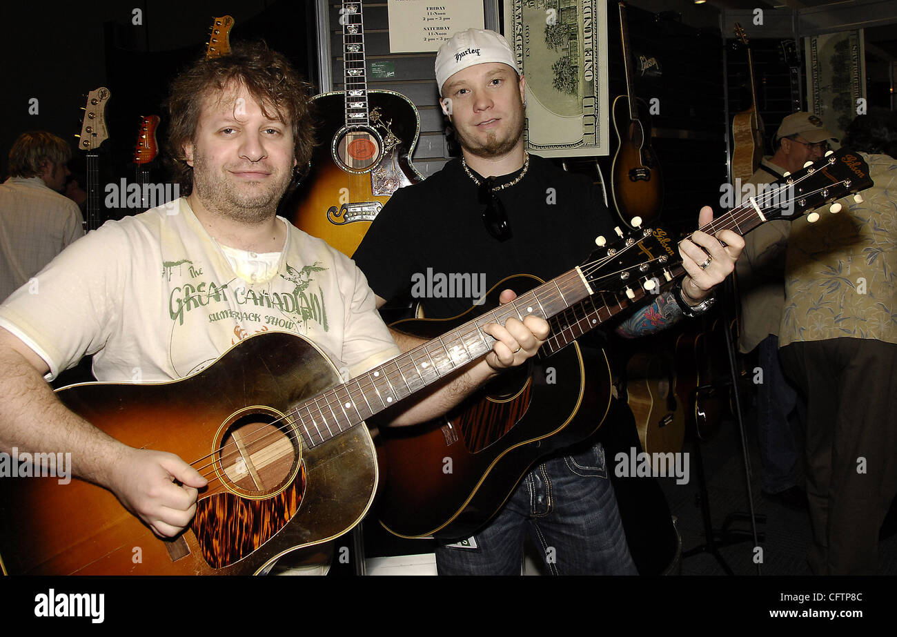 January 19, 2007; Anaheim, CA, USA; Musicians MITCH MERRETT (L) and MIKE NORMAN of the band 'AARON PTITCHETT'  in the Gibson Guitar Corporation's booth at The NAMM Show '07. Mandatory Credit: Photo by Vaughn Youtz/ZUMA Press. (©) Copyright 2007 by Vaughn Youtz. Stock Photo
