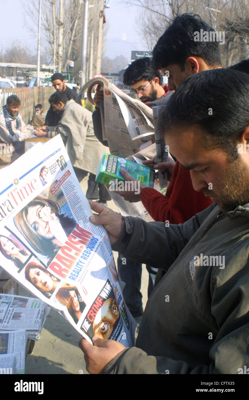 A Kashmiri person reads a local newspaperforthe latest news regarding the racist row involving Indian actress ad British actors during a reality TV show 'Big Brother' in London. The row has generated lot of interest in India and extreme reaction has been pouring in from every quarter Thrusday Janura Stock Photo