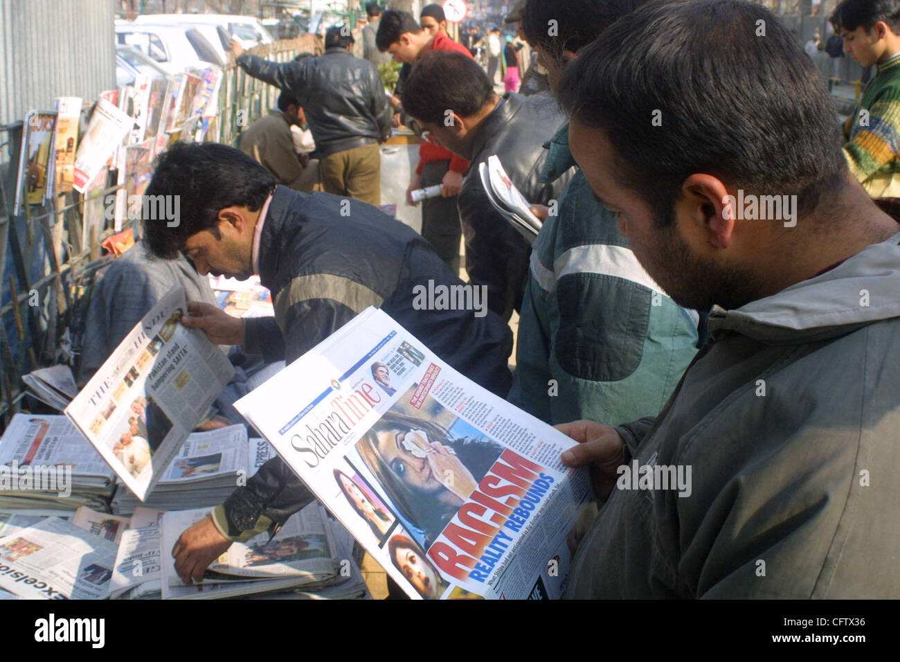 A Kashmiri person reads a local newspaperforthe latest news on regarding the racist row involving Indian actress ad British actors during a reality TV show 'Big Brother' in London. The row has generated lot of interest in India and extreme reaction has been pouring in from every quarter Thrusday Jan Stock Photo