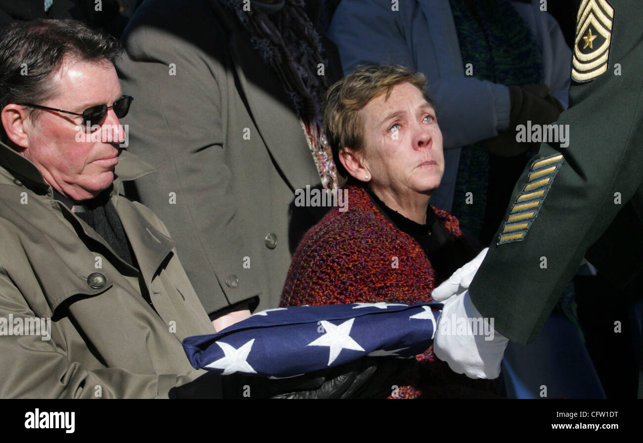 STORMI GREENER • sgreener@startribune.com 1/30/2007 Minneapolis, MN--  THIS PHOTO: Family of young Marine Spc E4 Chip Edstrom Father of Clayton L. (Chip) Edstrom III, Clayton L. Edstrom II receives the American flag from a member of the Military Funeral Honors Team 88th RRC at Fort Snelling. next to Stock Photo