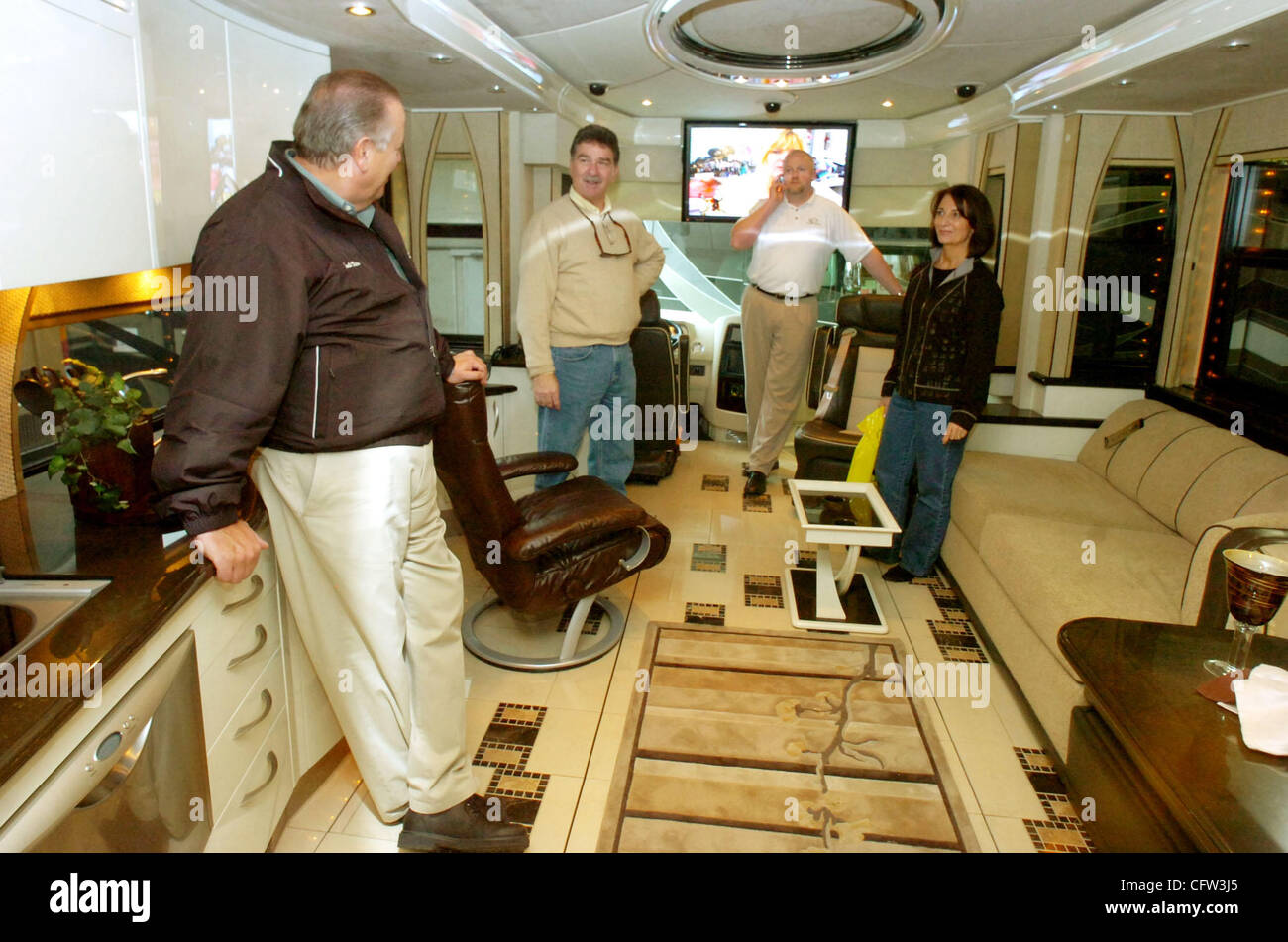 (from left) Renold Victor, owner of Sacramento Country Coach, Rod Lowe of Modesto, Calif., Jeff Howe, with Country Coach and Karen Lowe of Modesto, Calif., talk about the 1.3 million dollar  Country Coach RV for sale at the 2007 Manufacturers' RV Show held at the Alameda County Fairgrounds in Pleasa Stock Photo