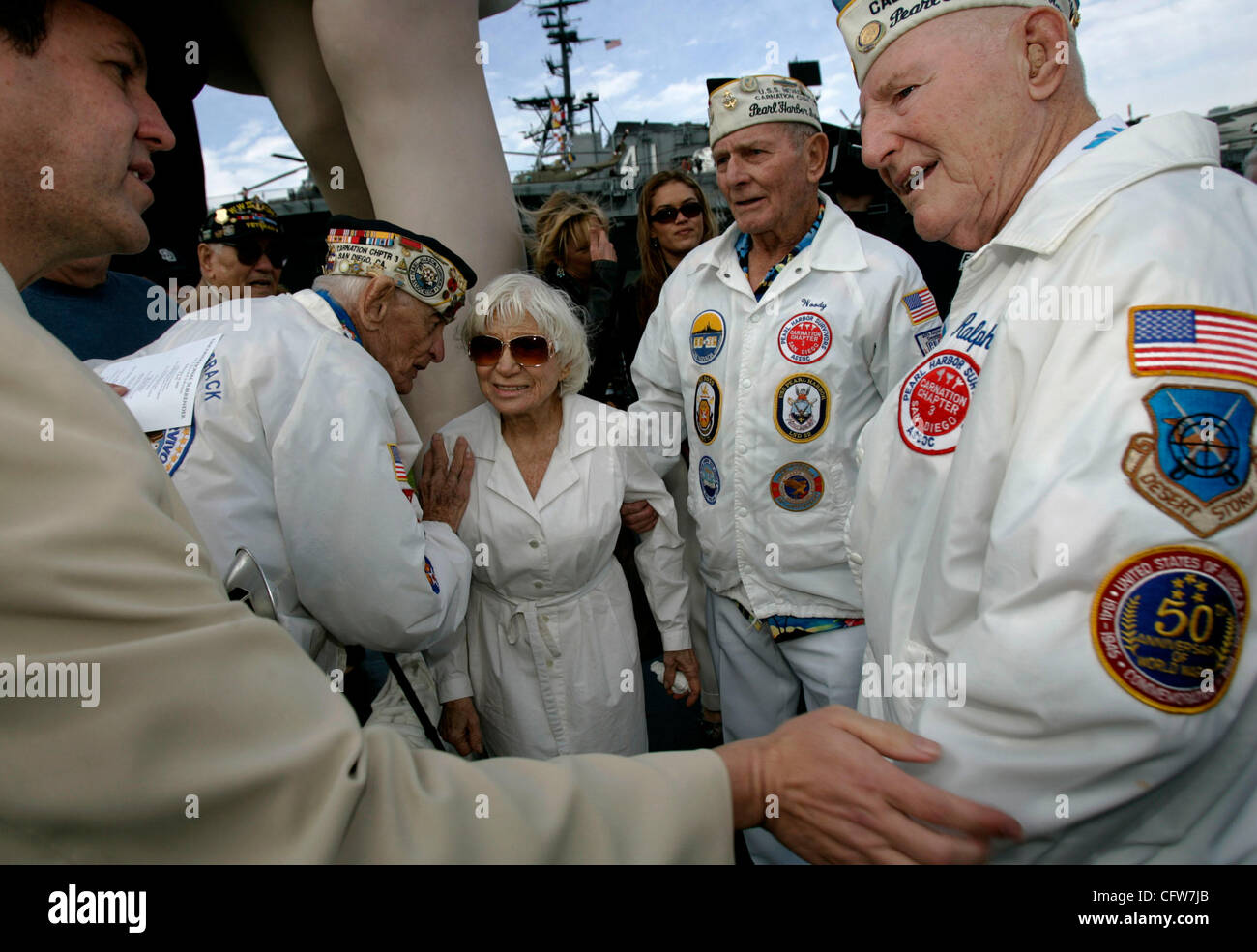 February 10, 2006 San Diego, CA AARON ROSENBERG of Hollywood, California, left, and EDITH SHAIN<cq> of Century City, California, center, listen to members of Pearl Harbor Survivors Association, Carnation Chapter in San Diego, from left; ALLEN BODENLOS of Hillcrest, WOODY DERBY of Allied Gardens, cen Stock Photo