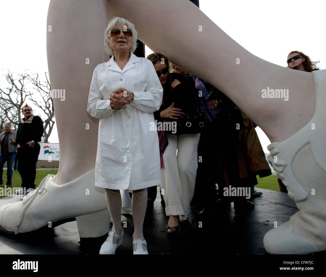 February 10, 2006 San Diego, CA EDITH SHAIN<cq> of Century City, California, center, talks to fans and onlookers under a 25-foot tall, 6,000-pound sculpture by J. SEWARD JOHNSON, called 'Unconditional Surrender', which was unveiled at the park near Tuna Harbor in downtown San Diego, California. The  Stock Photo