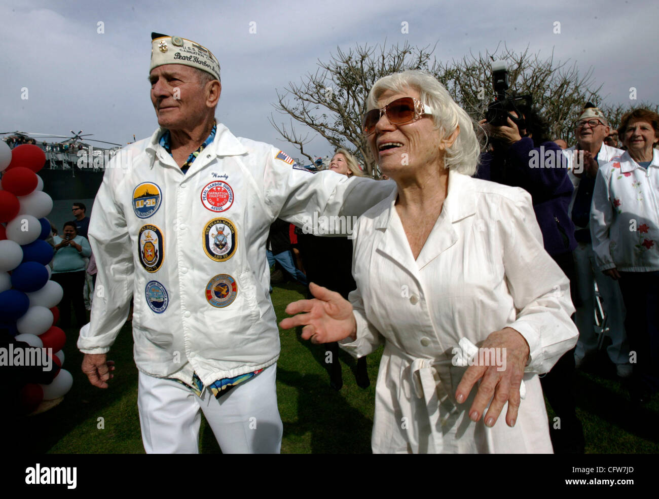 February 10, 2006 San Diego, CA  Pearl Harbor Survivors Association, Carnation Chapter in San Diego member WOODY DERBY of Allied Gardens, left, and EDITH SHAIN<cq> of Century City, California, right, watch as a 25-foot tall, 6,000-pound sculpture by J. SEWARD JOHNSON, called 'Unconditional Surrender Stock Photo