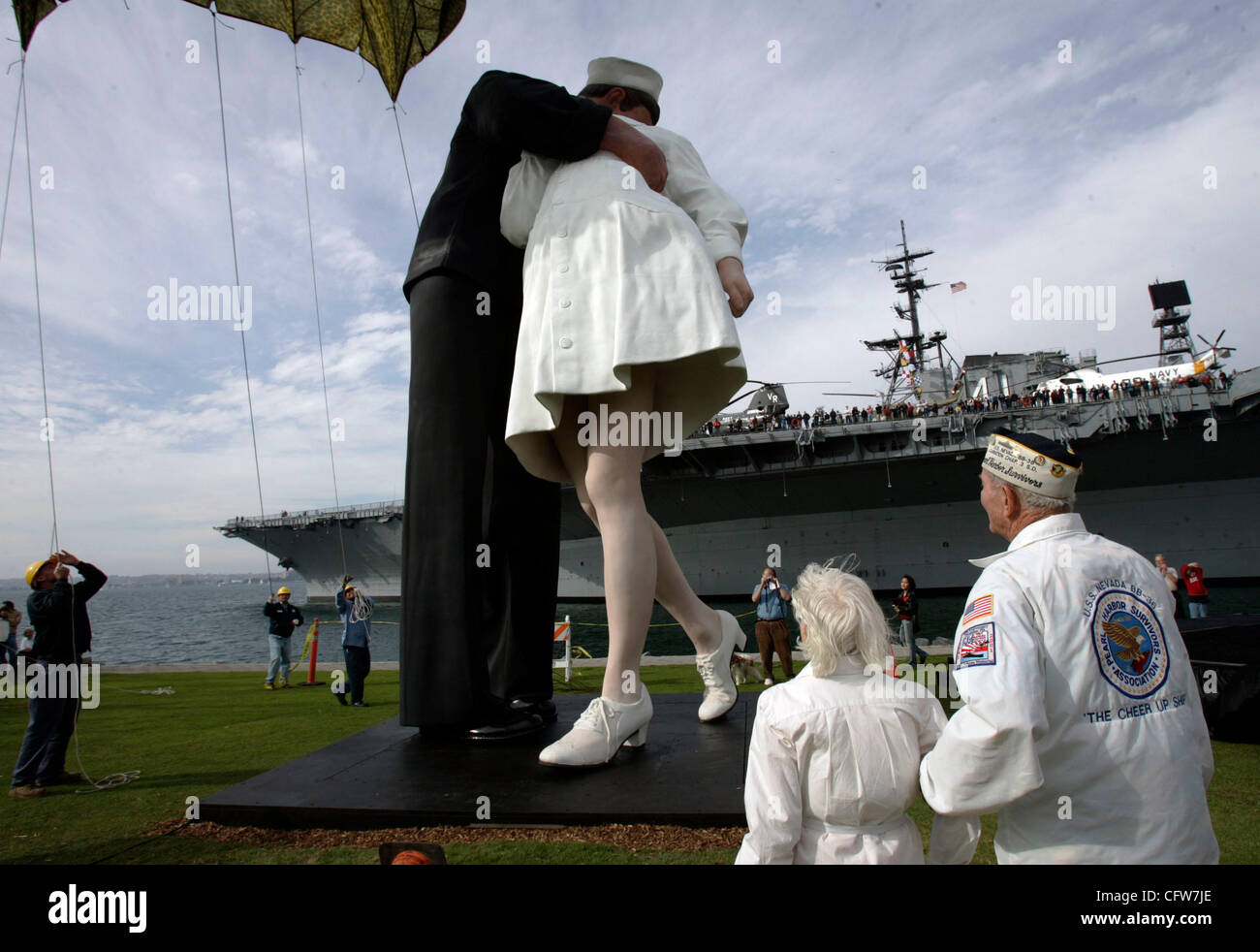 February 10, 2006 San Diego, CA  EDITH SHAIN<cq> of Century City, California, left, and Pearl Harbor Survivors Association, Carnation Chapter in San Diego member WOODY DERBY of Allied Gardens, right, watch as a 25-foot tall, 6,000-pound sculpture by J. SEWARD JOHNSON, called 'Unconditional Surrender Stock Photo