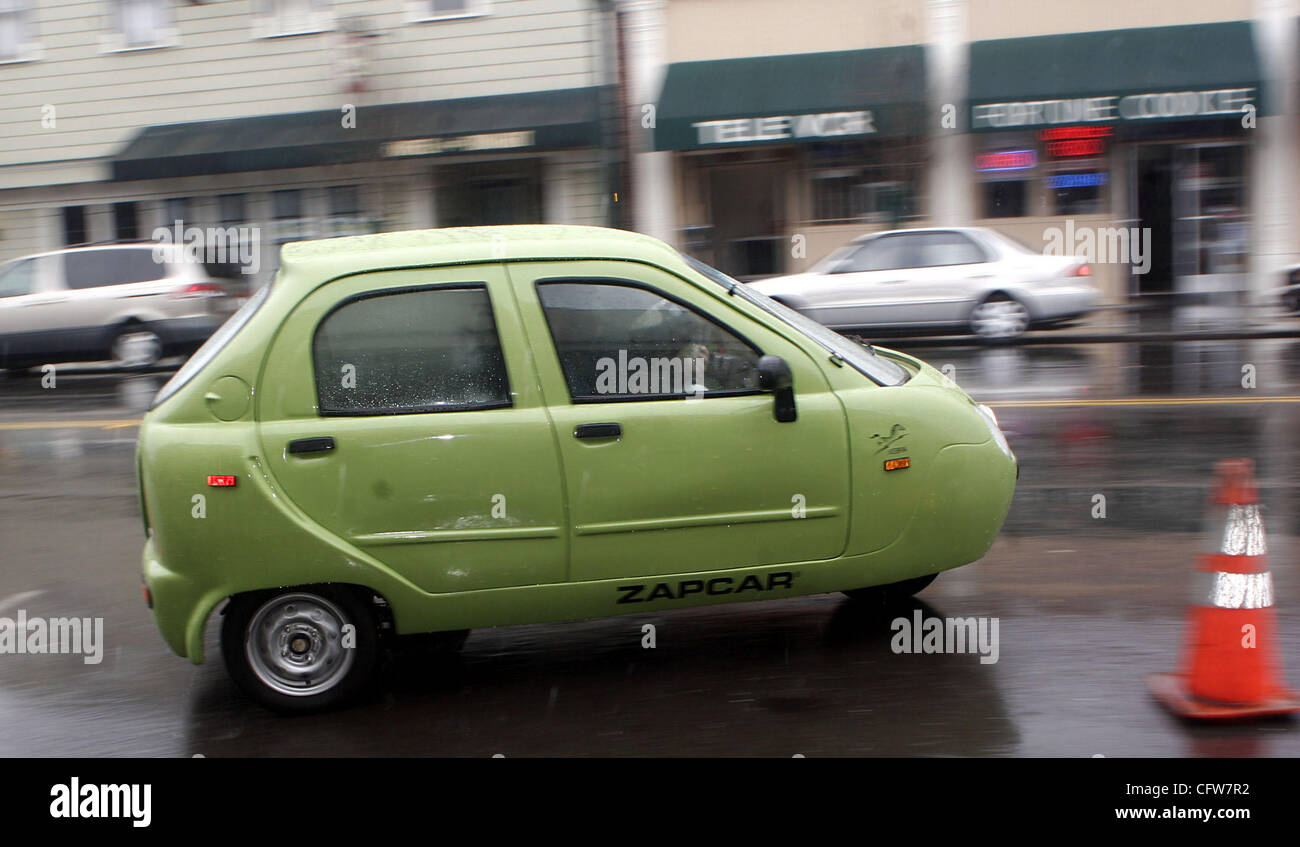 A visitor test drives a 100 electric Zap Xebra sedan at O