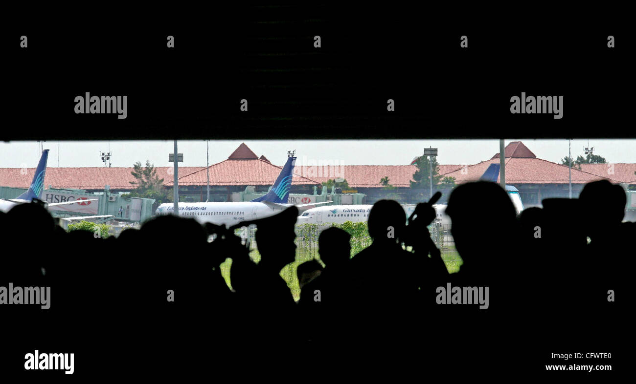 Jakarta, Indonesia March 08, 2006  Officer of Garuda, Indonesia Police, and Journalist waiting for arrival of coffin's victim Garuda crash from Yogyakarta at the Sukarno Hatta Airport, Jakarta. On March 07, 2006 Boeing 737-300 Garuda Indonesia airplane with flight number GA 200 crash and burned afte Stock Photo