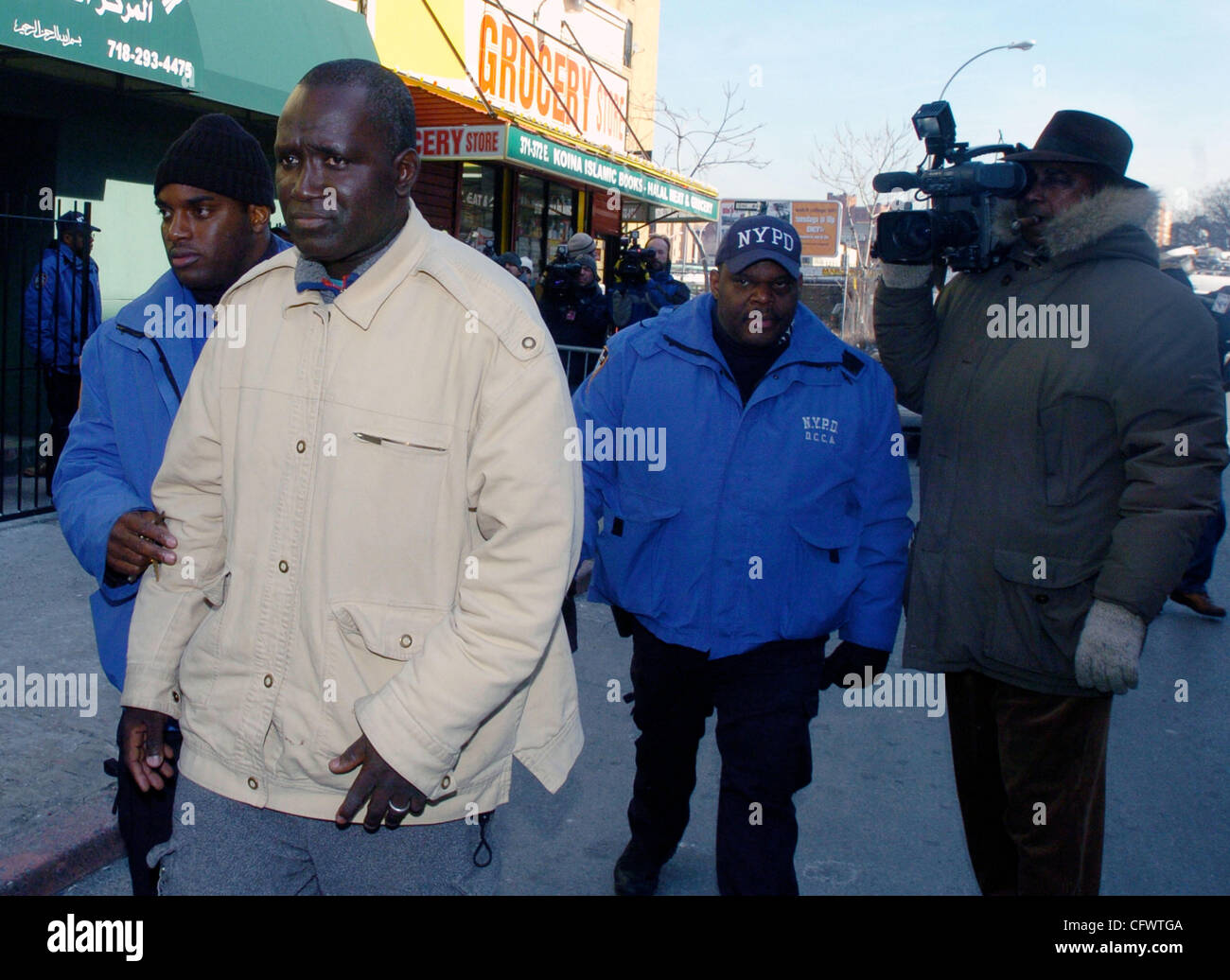 Mamadou Soumare exits the mosque as family members and friends of those