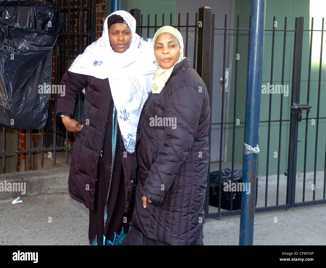 Manthia Magassa (L) exits the mosque as family members and friends of