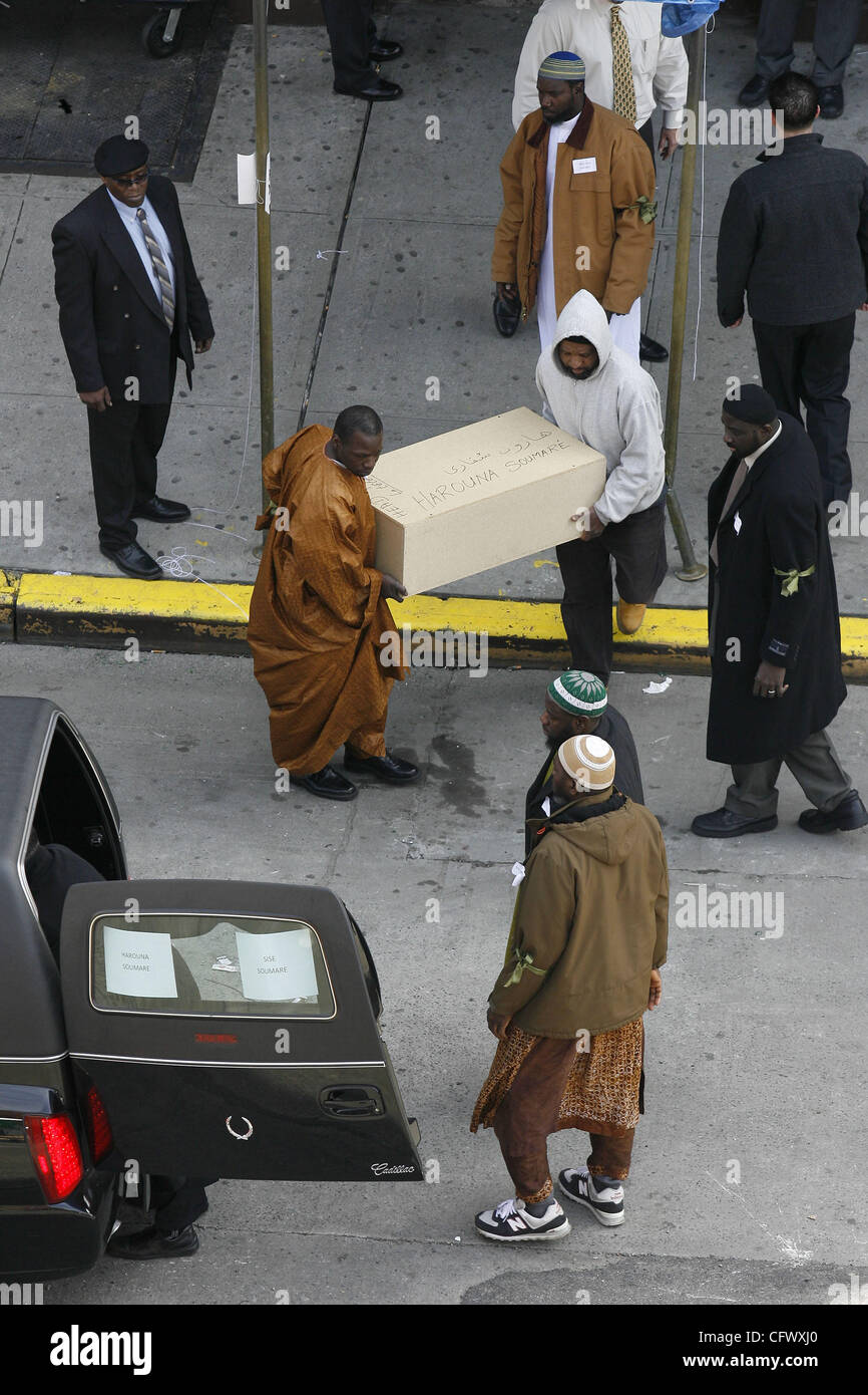 Mar 12, 2007 - Bronx, New York, USA - The pine casket of Harouna Soumare, male, six months, is placed into a hearse at the funeral home in East Harlem, on it's way to the funeral service at an Islamic Cultural Center in the Bronx, New York on Monday, March 12, 2007.  Nine children and one adult peri Stock Photo