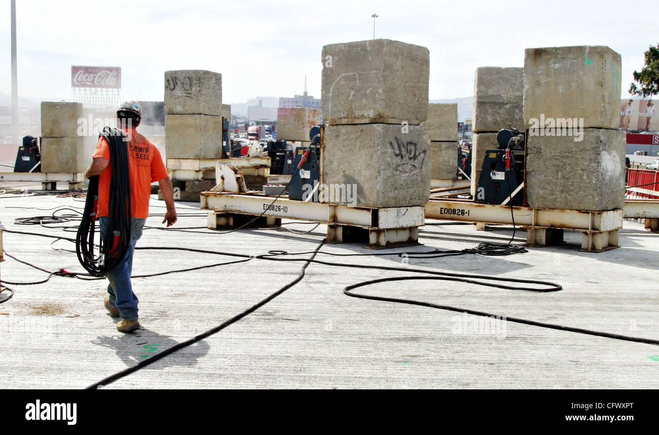 A Caltrans worker walks through the Stonehenge-like blocks that serve ...