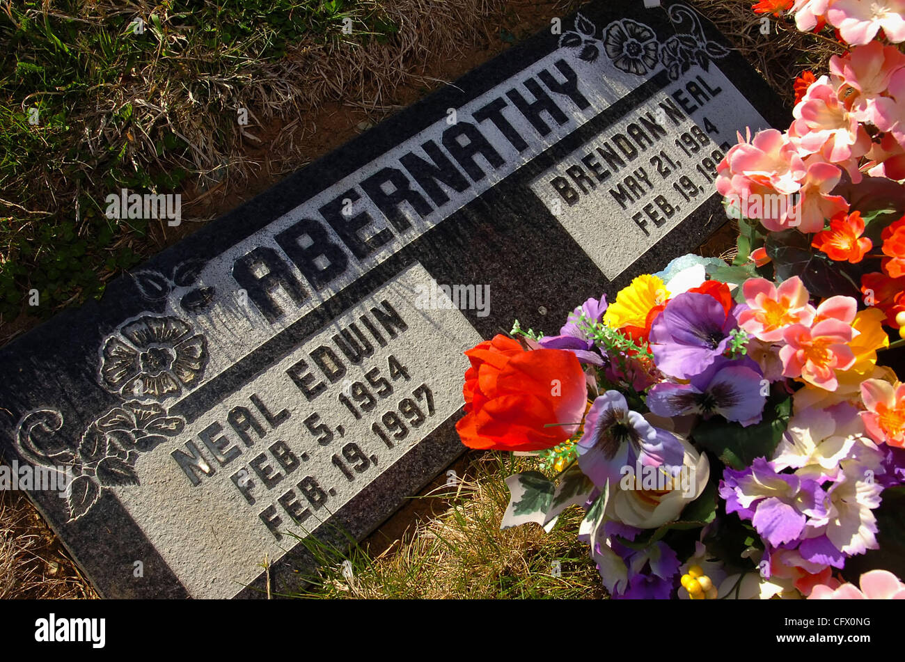 The gravestone of Neal Abernathy, age 43, and his son Brendan Abernathy