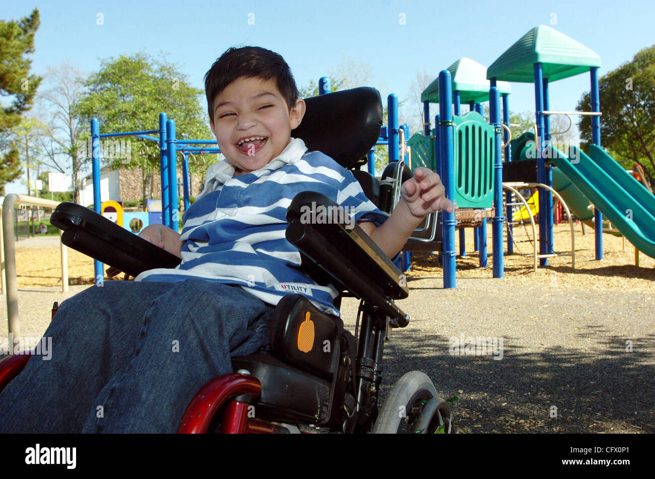 Matteo Lamach, 6, enjoys the great spring-like weather at Hillcrest Park on Olivera Road on March 16, 2007 in Concord, Calif. A New York-based architect has finally finished the design for Matteo's Dream, a Concord playground built for children with disabilities, and city leaders announced that volu Stock Photo