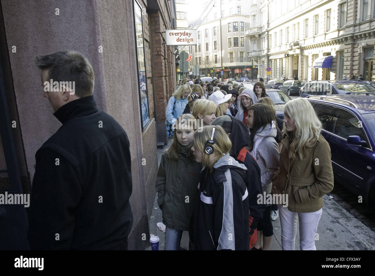 The Audience Lines Up In The Cold Waiting For The Doors To