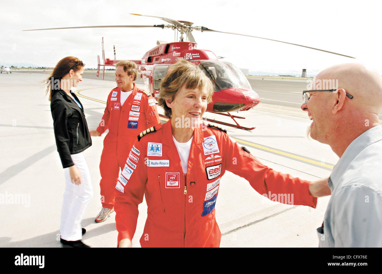 Helicopter pilots Colin Bodill, second from left, and Jennifer Murray