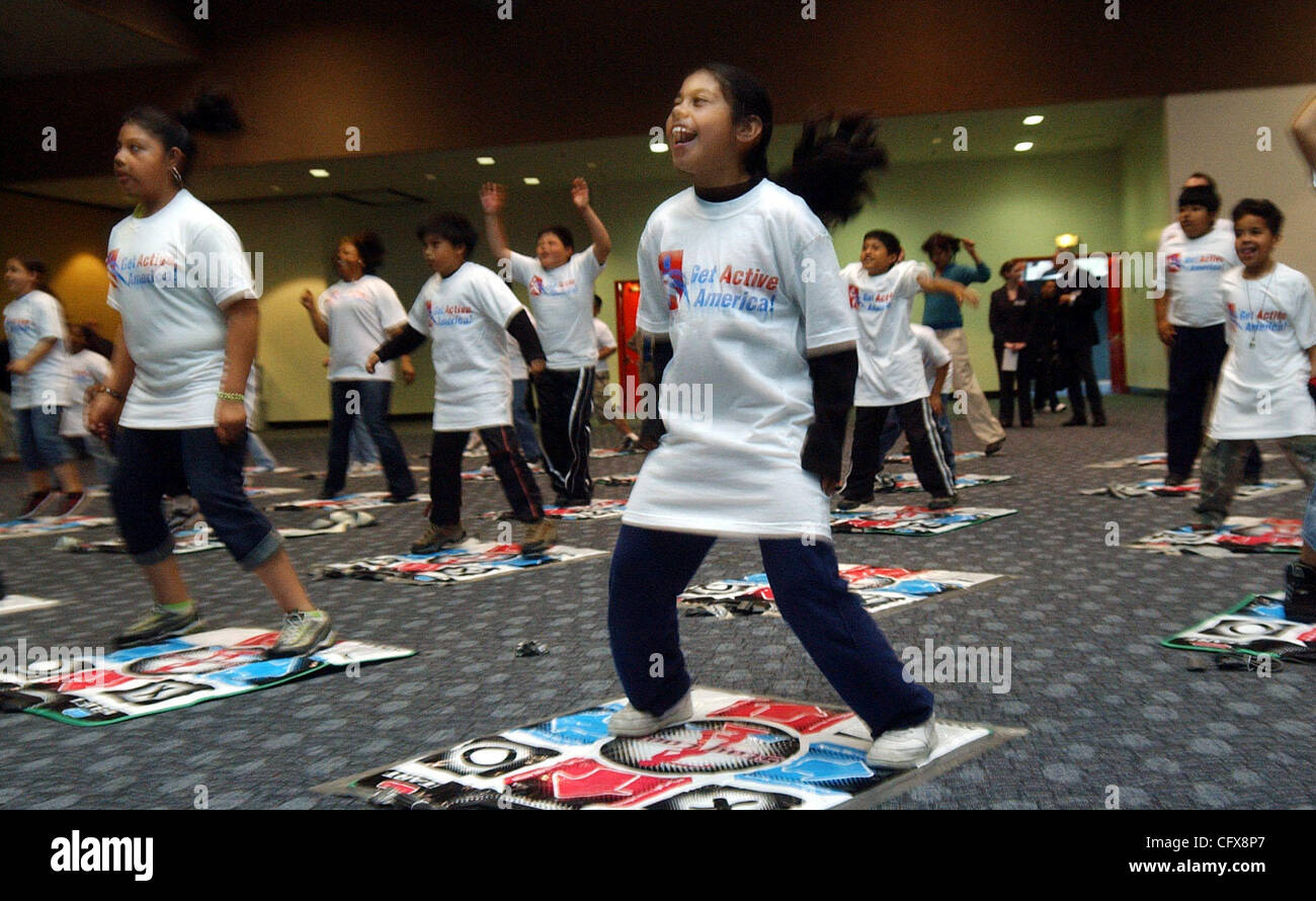 Fourth-grade student Maria Ramos, 10, joins classmated from Cesar Chavez School in San Francisco at the International Health, Raquet and Sportclub Association convention in San Francisco, Calif., on Wednesday, March 28, 2007. Dance mats made by Konami were set out for students to use during the Danc Stock Photo
