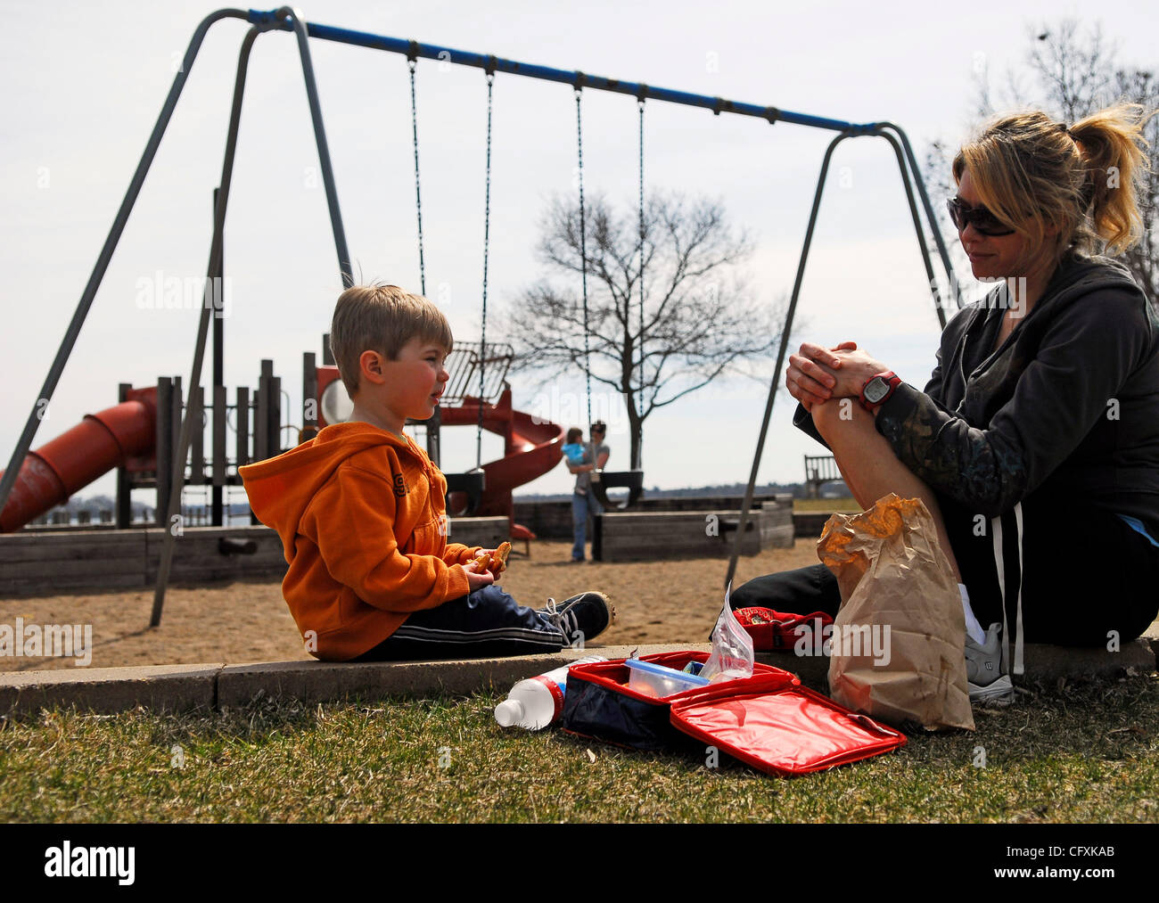 Wayzata, Mn. Monday 4/16/2007.Alicia Timko of Orono has lunch lakeside with her 3 yr old son Dalton at a playground near Lake Minnetonka, Mn...GENERAL INFORMATION: weather features  (Credit Image: © Minneapolis Star Tribune/ZUMA Press) Stock Photo