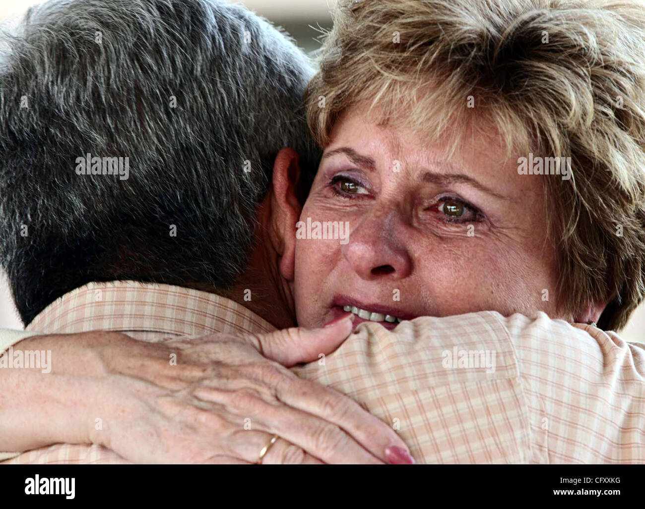 Abel Hernandez, of Bakersfield, Ca and Tricia Leonard, of Pleasanton, (LtoR) Ca embrace during their first face to face meeting at the California Transplant Donor Network recognition ceremony being held Saturday April 28 at Chabot College, in Hayward, Ca. Hernandez is donor recipient of Leonard's so Stock Photo