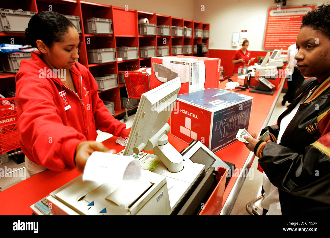 Minneapolis, MN - May 2, 2007 - Target cashier Tracy Willey, left,  completes a return of a DVD/VCR player with  TravetteÃŠCampbell,ÃŠ29,ÃŠaÃŠstudentÃŠatÃŠtheÃŠUniversityÃŠofÃŠMinnesota,  at the downtown Target Wednesday. Target Corp., which has a notoriously