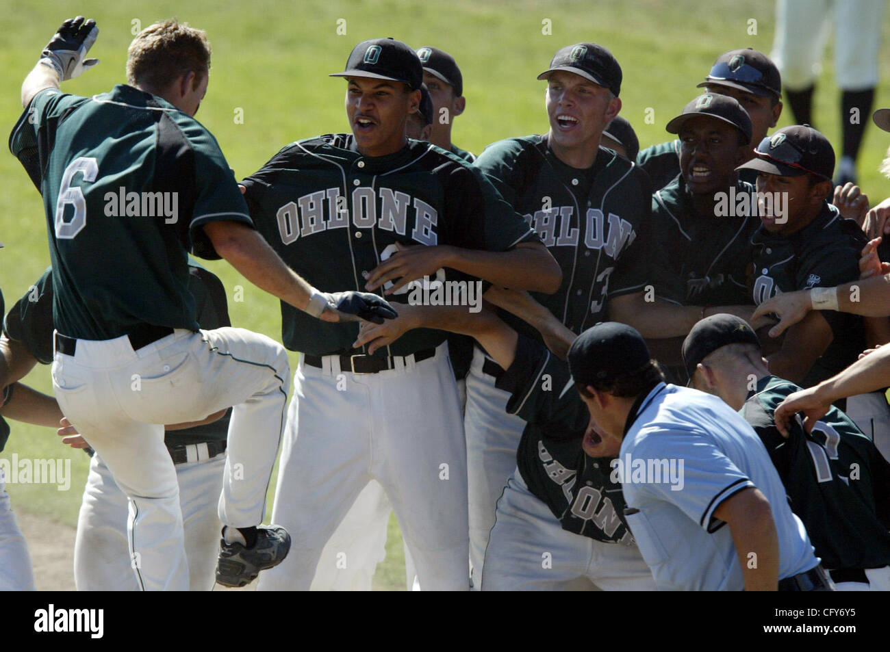 Ohlone College baseball players wait at home plate to celebrate 6 Matt