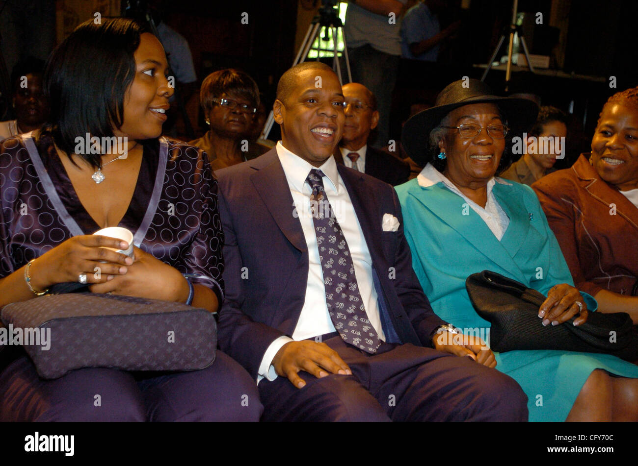 JayZ (C) seated with family in City Council Chambers. Gloria Carter