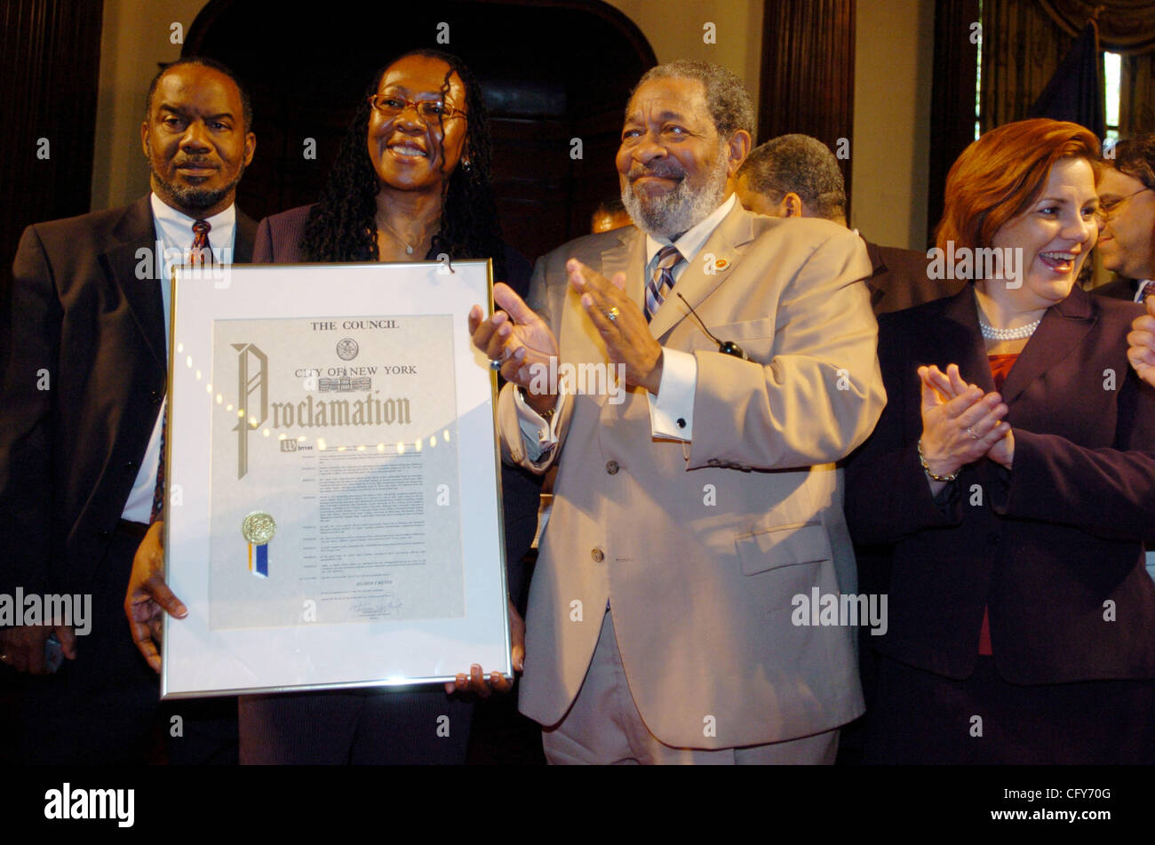 Gloria Carter holding a proclamation with City Councilman White (R