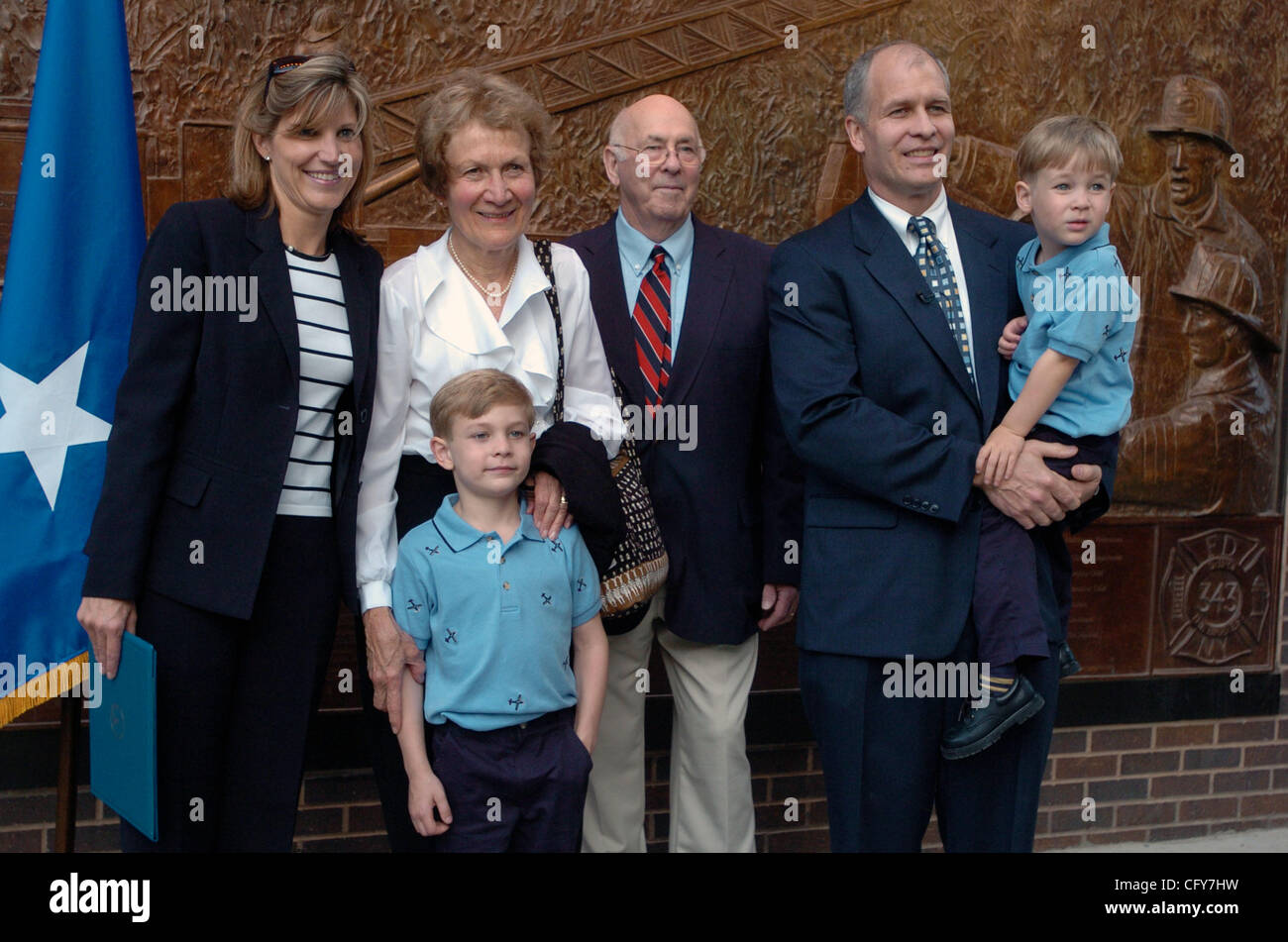 Dr. Alan Flower (R) holding his son Jackson, 3 yrs. old with his wife Kristie (L), his other son Jordan, 6 and his parents Margaret and Jerry Flower. Dr. Alan Flower, 41, of Bayville, Long Island is sworn in as an active-duty Major in the United States Air Force. Dr. Alan Flower will be stationed at Stock Photo