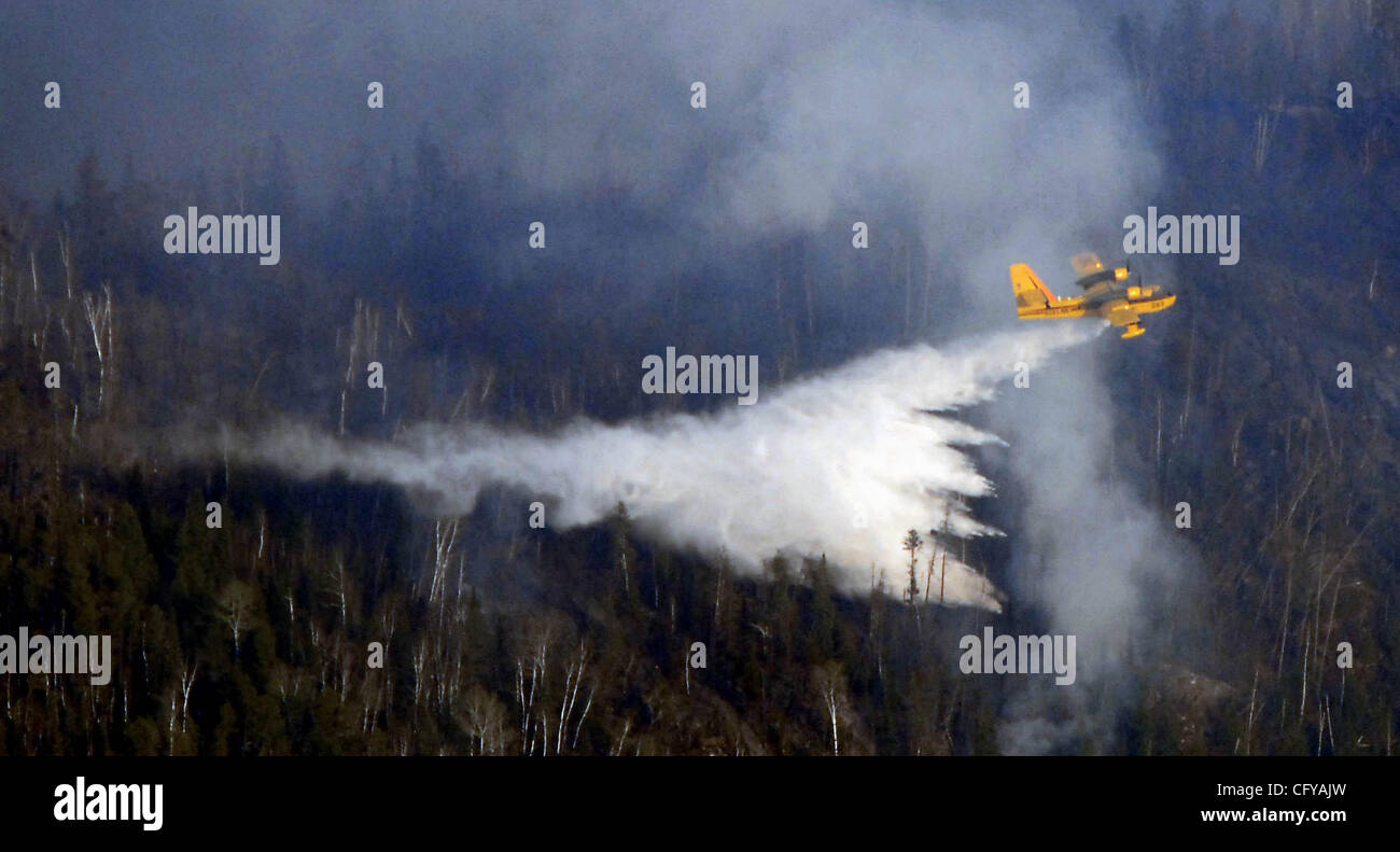 Gunflint Trail Monday 5/7/2007.Ham Lake fire on the Gunflint Trail- In this picture: Minnesota DNR plane drops water on the Ham Lake Fire.  (Credit Image: © Minneapolis Star Tribune/ZUMA Press) Stock Photo