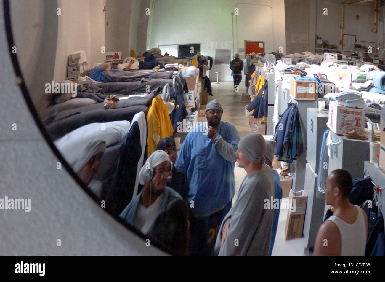 Prisoners sleep in bunks stacked three high inside the gym in yard one