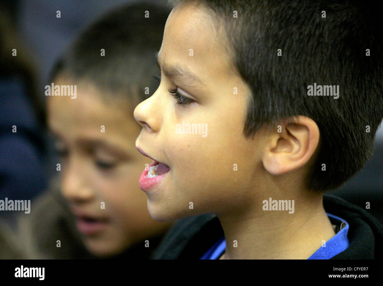May 16, 2007, Oceanside, California_At San Luis Rey Elementary School first grader CYRUS GREENE sings along with a song being played on the guitar by teacher JENNY REES_Mandatory Credit: photo by Charlie Neuman/San Diego Union-Tribune/Zuma Press. copyright 2007 San Diego Union-Tribune Stock Photo