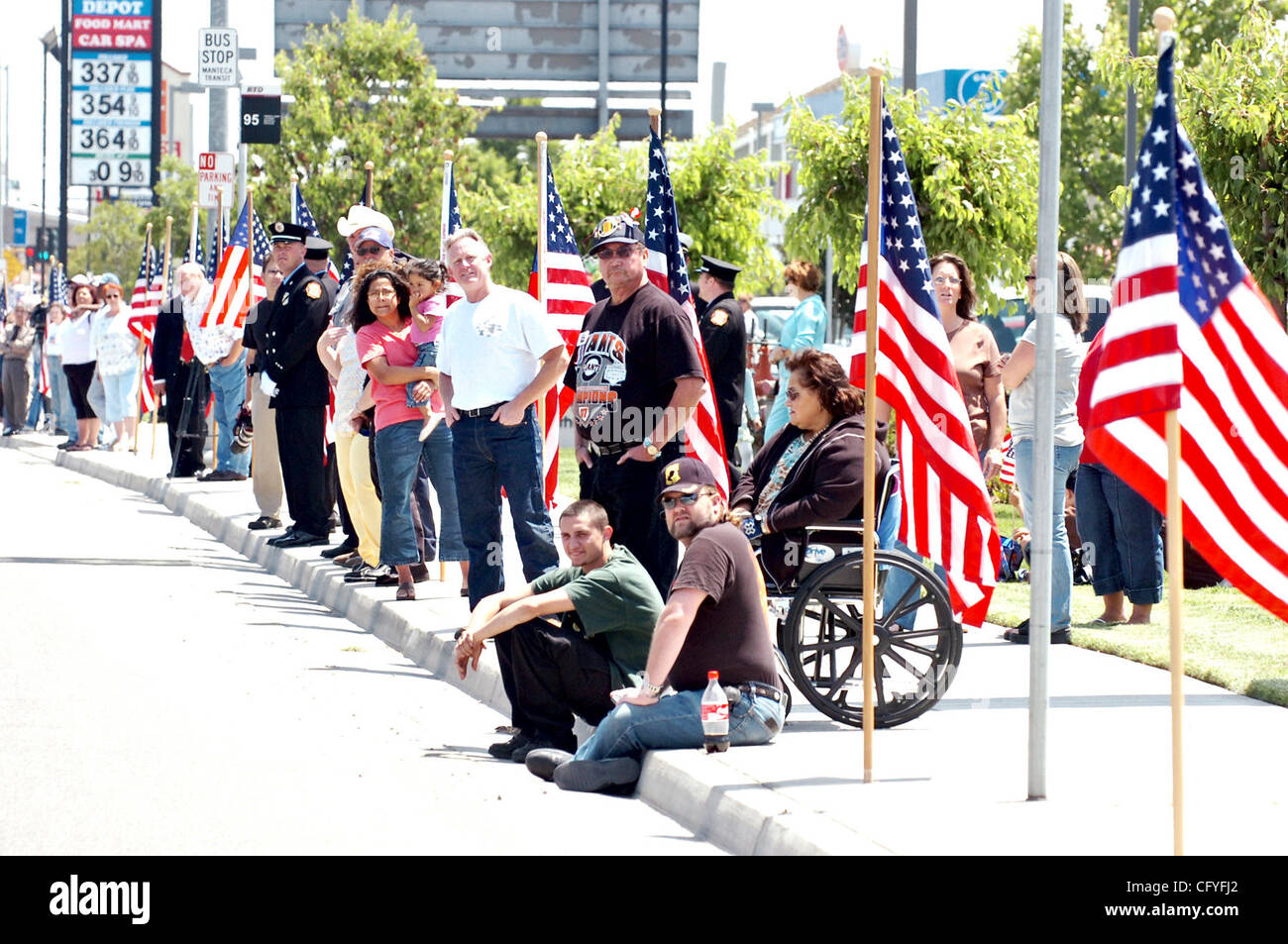 Crowds line the funeral procession route of fallen Marine Cpl. Charles