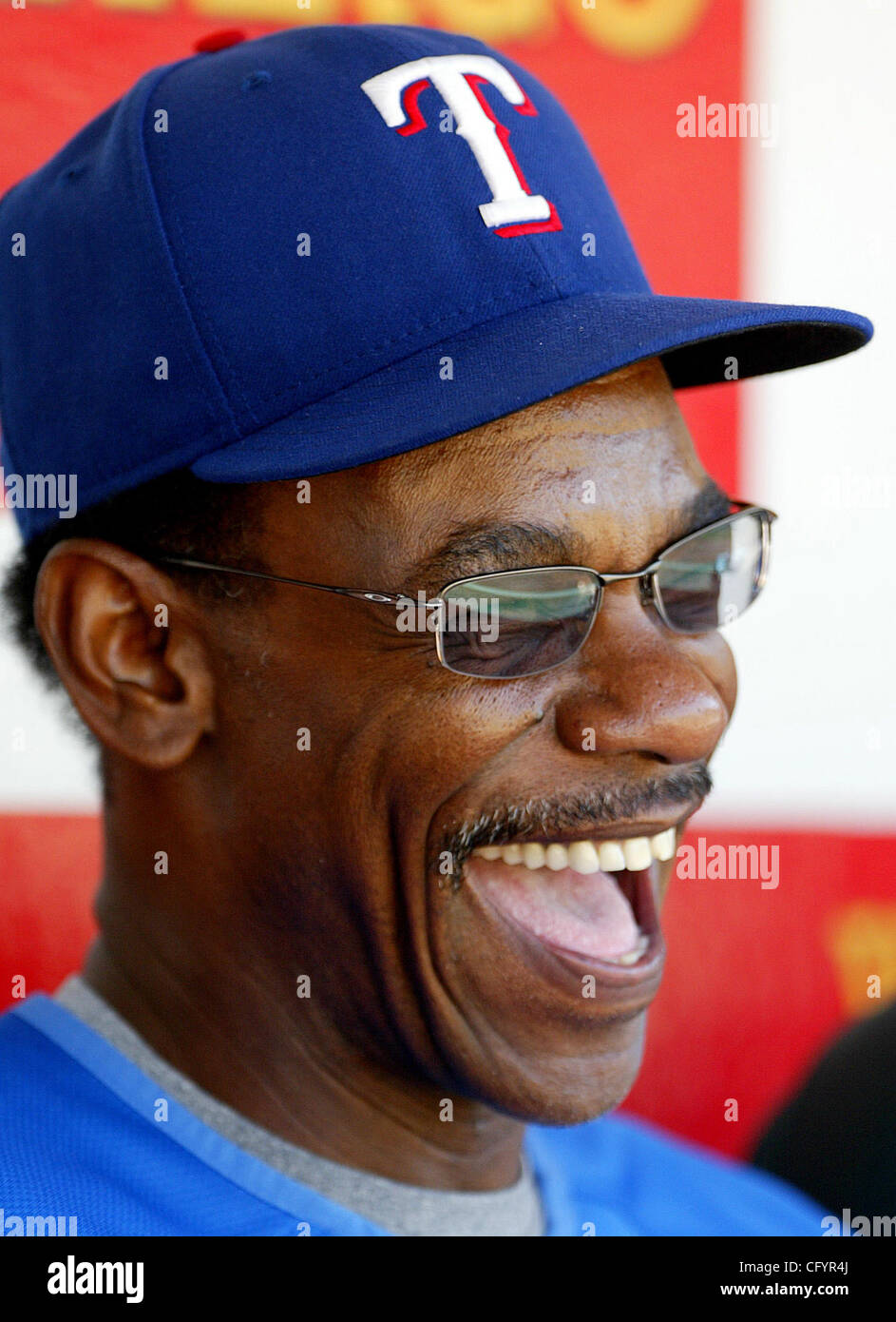 Texas Rangers manager Ron Washington laughs in the dugout before their
