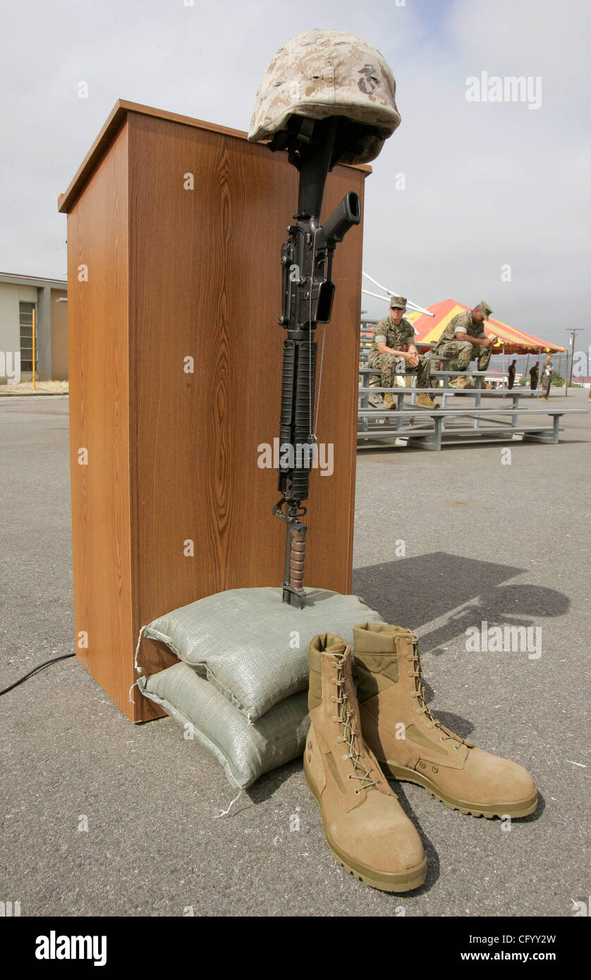 June 4, 2007, Camp Pendleton, California, USA Detail view of the military 'dog tag' of killed Marine Cpl. Jason Clairday hanging from a rifle positioned vertically with its bayonet placed in sand bags that also a Marine helmet on top of it. This was just in front of the speaker's podium at the speak Stock Photo