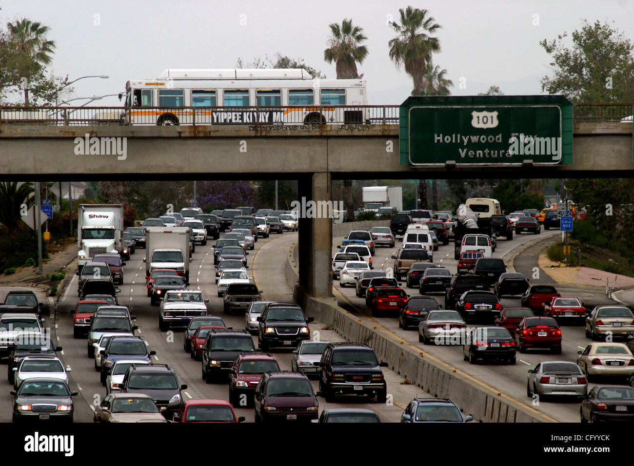 Jun 05, 2007; Los Angeles, CA, USA; A bus crosses a bridge as rush hour traffic backs up on the 101 freeway in downtown Los Angeles .The Metropolitan Transportation Authority board approved a moderate fare hike last month that will reduce the agency's structural budget deficit without gouging the lo Stock Photo
