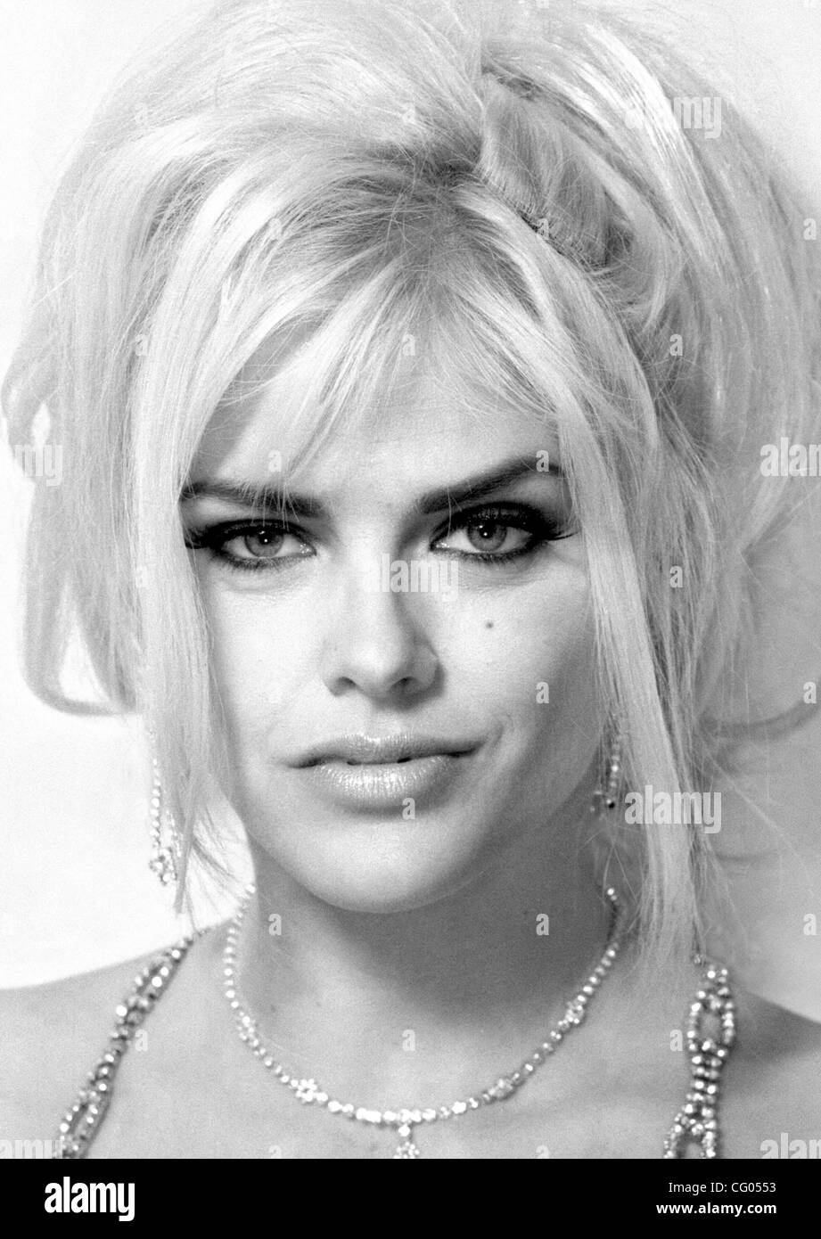 Jun 11, 2007 - Hollywood, Florida, USA - ANNA NICOLE SMITH, the voluptuous blonde whose life played out as an extraordinary tabloid tale - jeans model, Playboy centerfold, widow of an octogenarian oil tycoon, tragic mother - has died after collapsing at a hotel, aged  39.  Smith was born Vickie Lynn Stock Photo