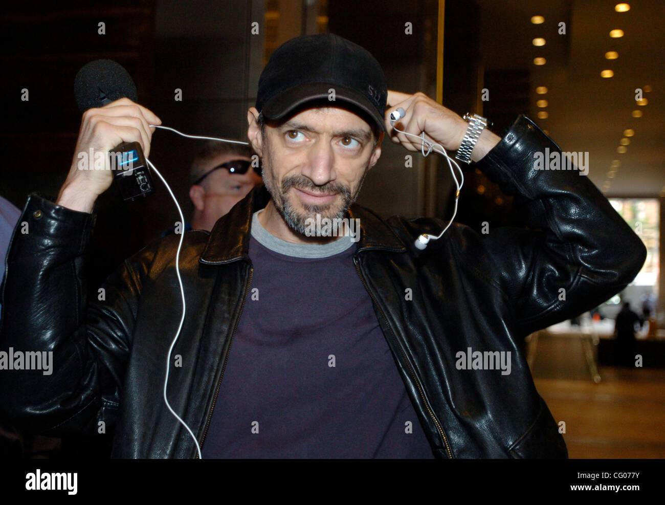 Radio personality Anthony Cumia puts on a microphone and headset as he ...