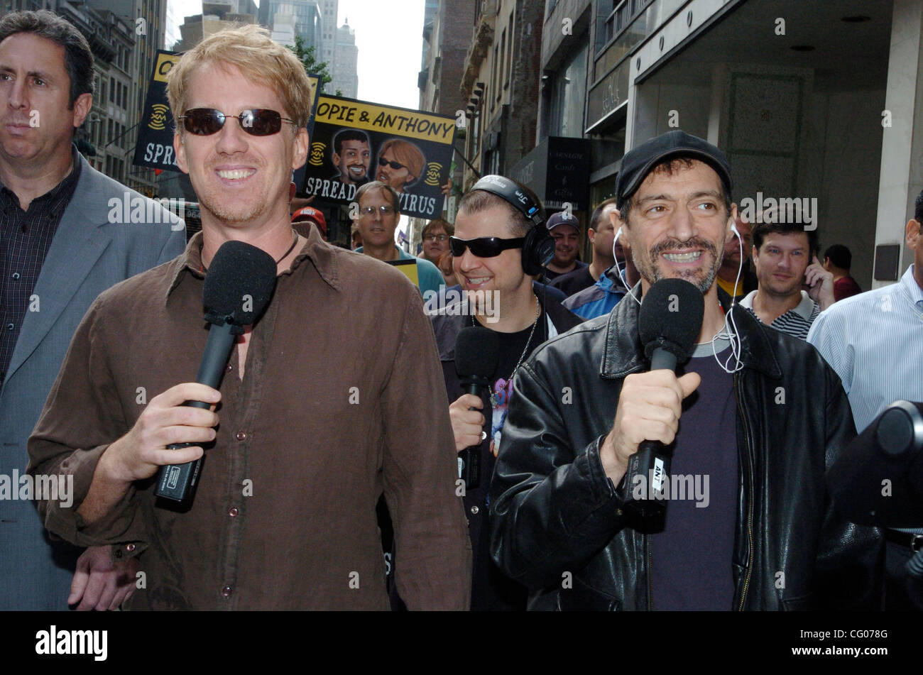Radio personalities Gregg "Opie" Hughes (R) and Anthony Cumia (L) walk