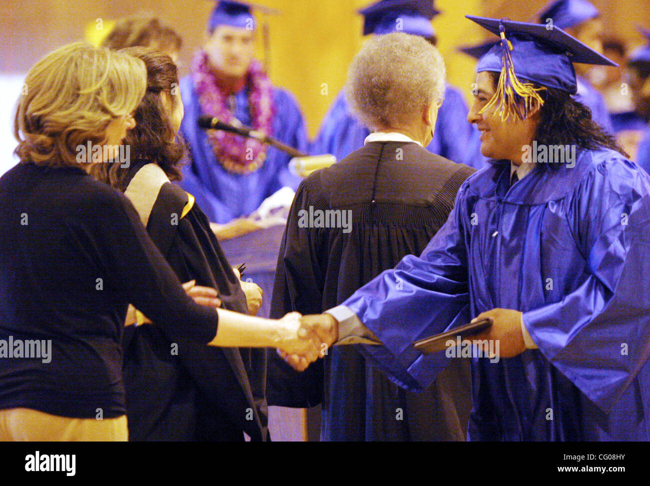 Ricardo Galindo receives his diploma graduation ceremonies at Hayward Adult School on Thursday, June 14, 2007, in Hayward, Calif. (Jane Tyska/The Daily Review) Stock Photo