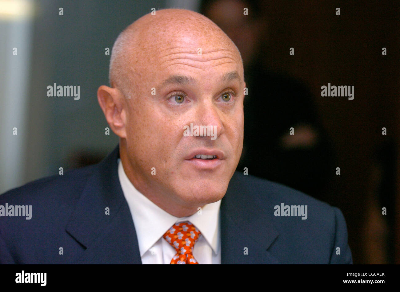 Cosmetic Surgeon Brad Jacobs speaks as attorney Michael Kelton holds