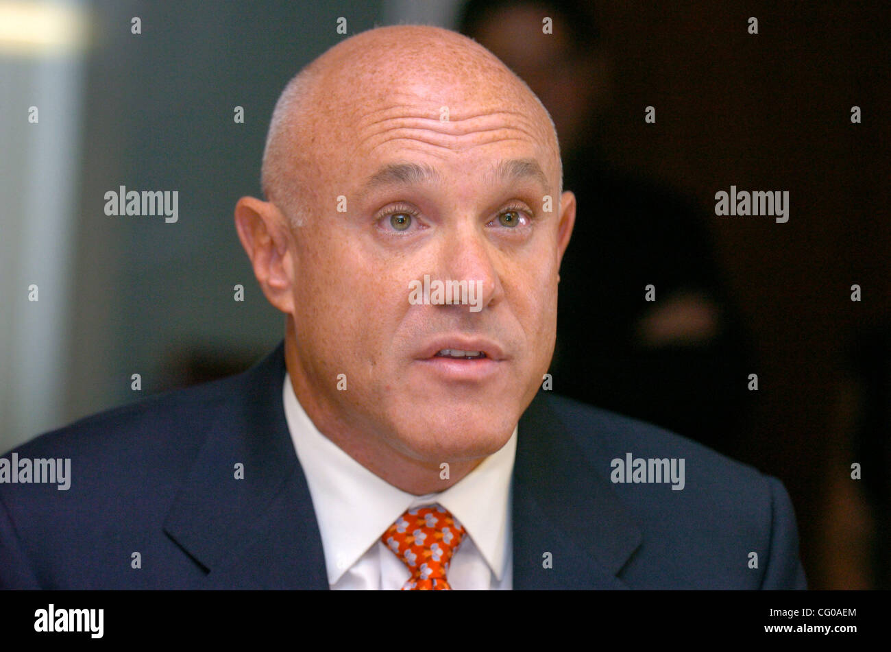 Cosmetic Surgeon Brad Jacobs speaks as attorney Michael Kelton holds