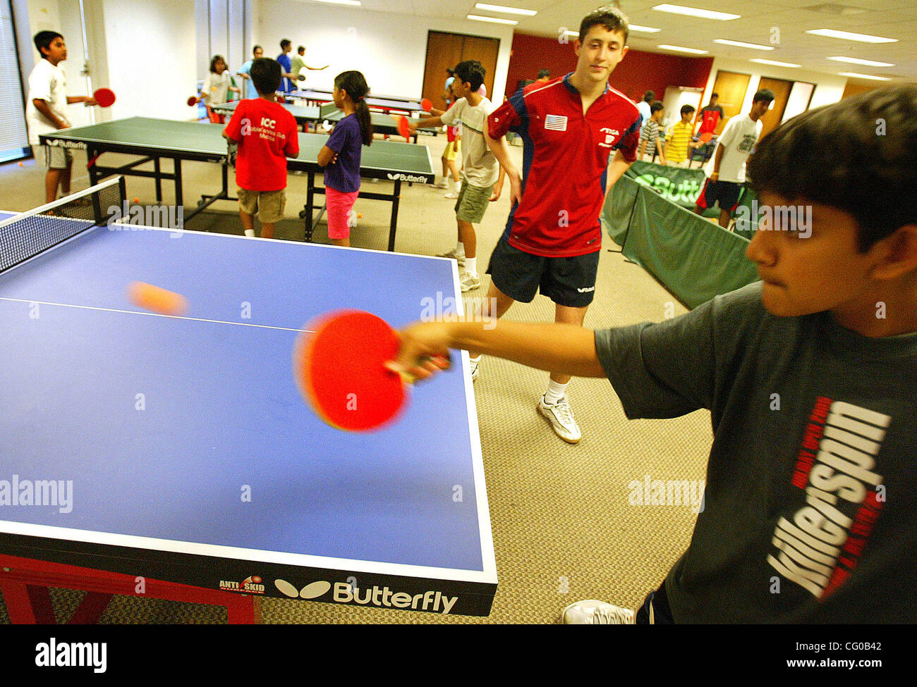 Paras Unadkat ,13,(right) practices under the watchfull eye of table tennis instructor Misha Kazantsev on Wednesday June 20, 2007 at the India Community Center in Milpitas, California. (Aric Crabb /The Oakland Tribune) Stock Photo