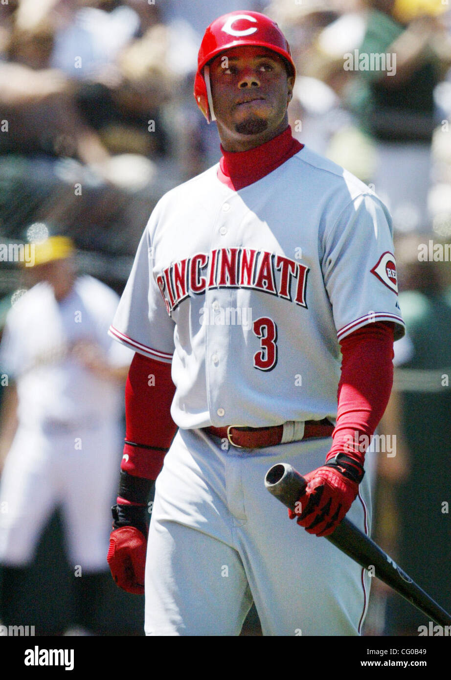 Reds Ken Griffey Jr. walks back to the dugout after striking out