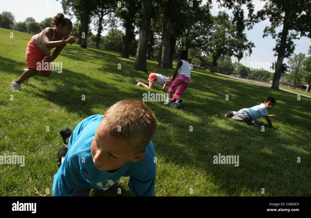 June 26, 2007 - Minneapolis, MN, USA - Andrew Askwith, 9, got up off the ground after the caller yelled ''rabbit'' the signal to head to one of to bases during a game of Fox and Rabbit at Camp CAC at thte Brooklyn Park Community Activity Center Tuesday morning. The day camp is from 9:15-4pm  weekend Stock Photo