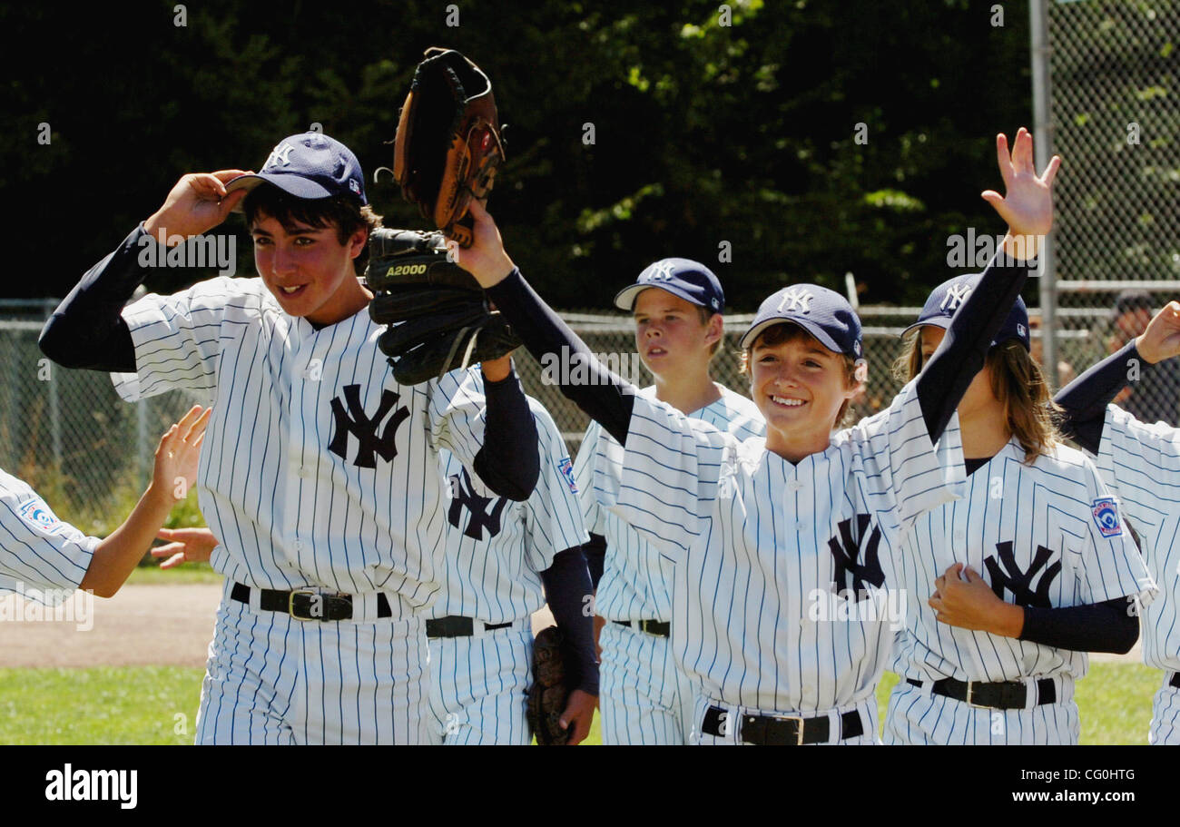 David Gilbert of the Alameda Yankees waves as his team comes off the