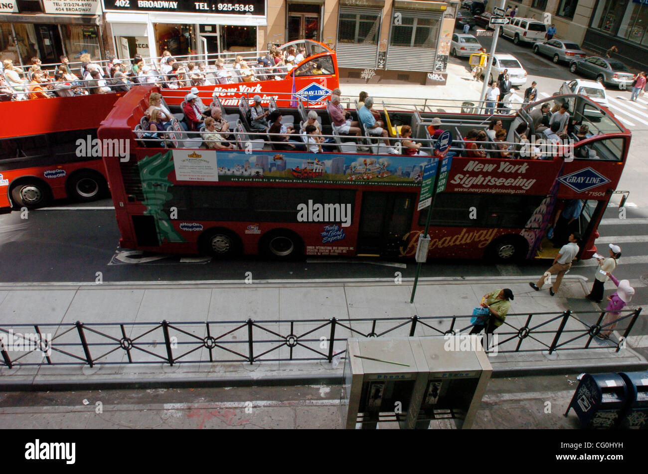 Buses stop at a "Bus Bulb", a new islandlike bus stop along lower Broadway designed to ease