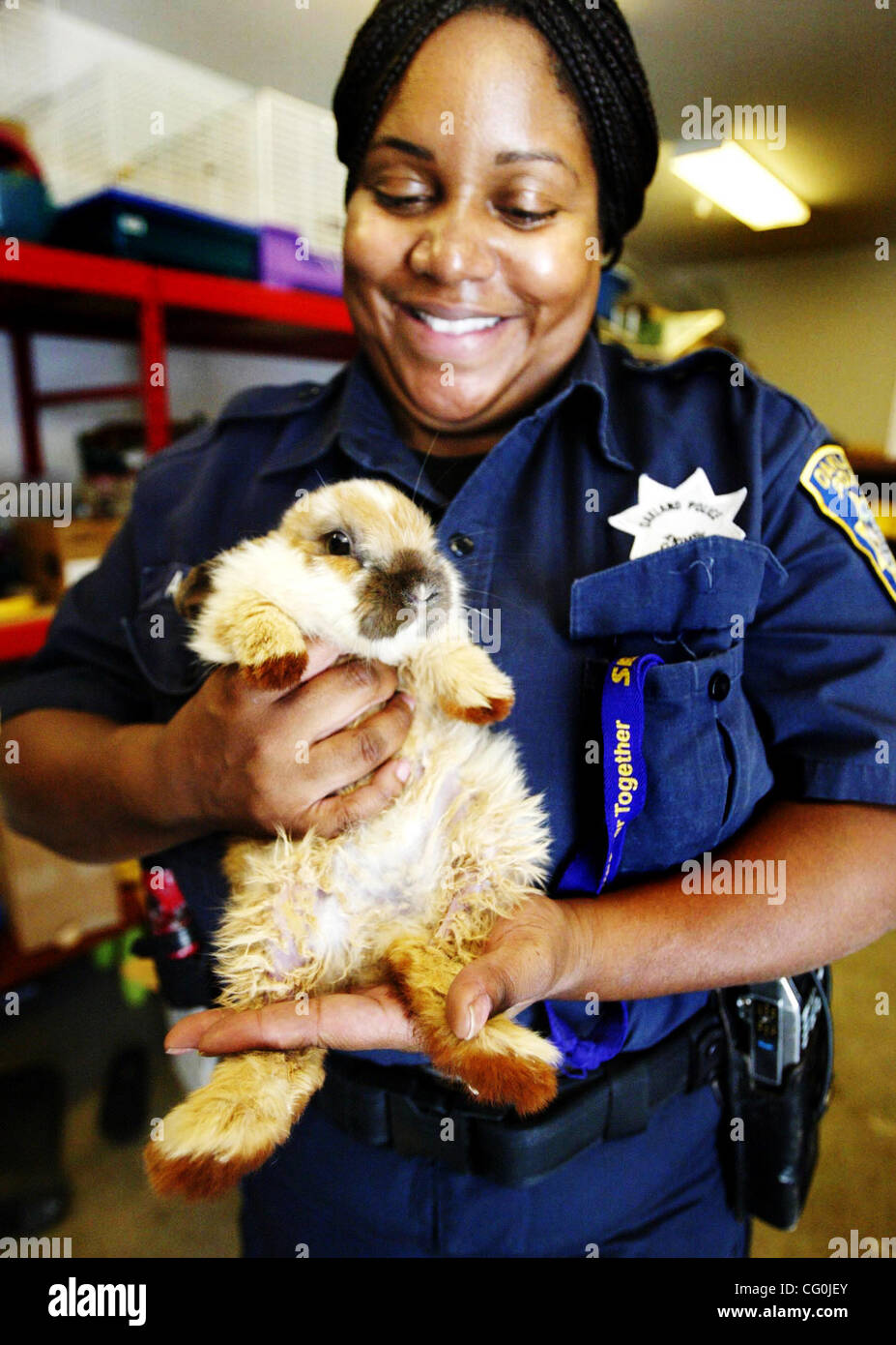 Animal Control officer Amaka Watson holds an starving fourweekold