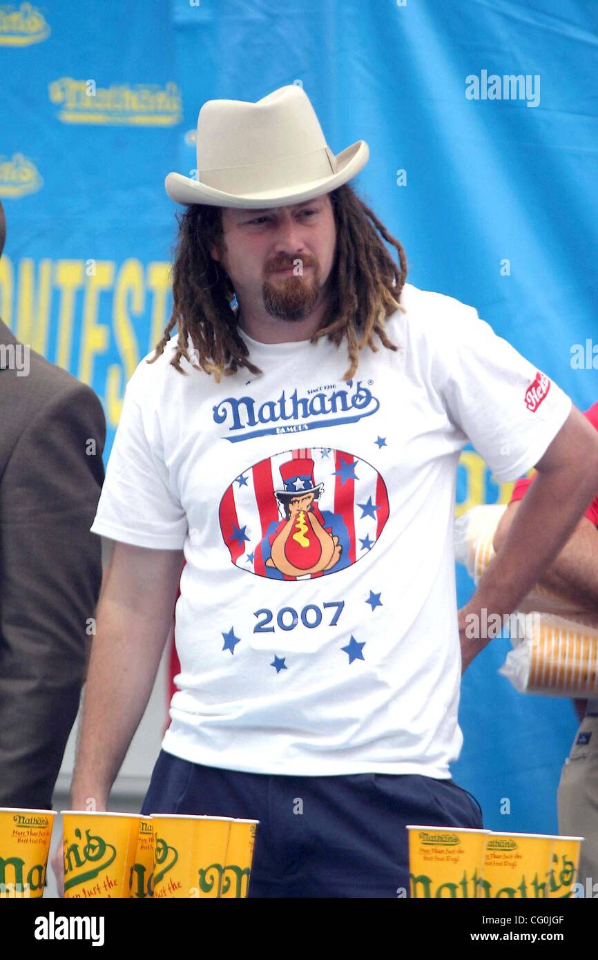 July 4, 2007 - New York, New York, U.S. - Nathan's Hot Dog Eating Contest held in Coney Island Brooklyn .New York . Joey Chestnut is the new Hot Dog Champ eating 66 hot dogs and the former champ Takeru Kobayashi with 63 hot dogs. Contestent ''crazy legs ''.Conti..              7 - 4 - 07     .  -    Stock Photo